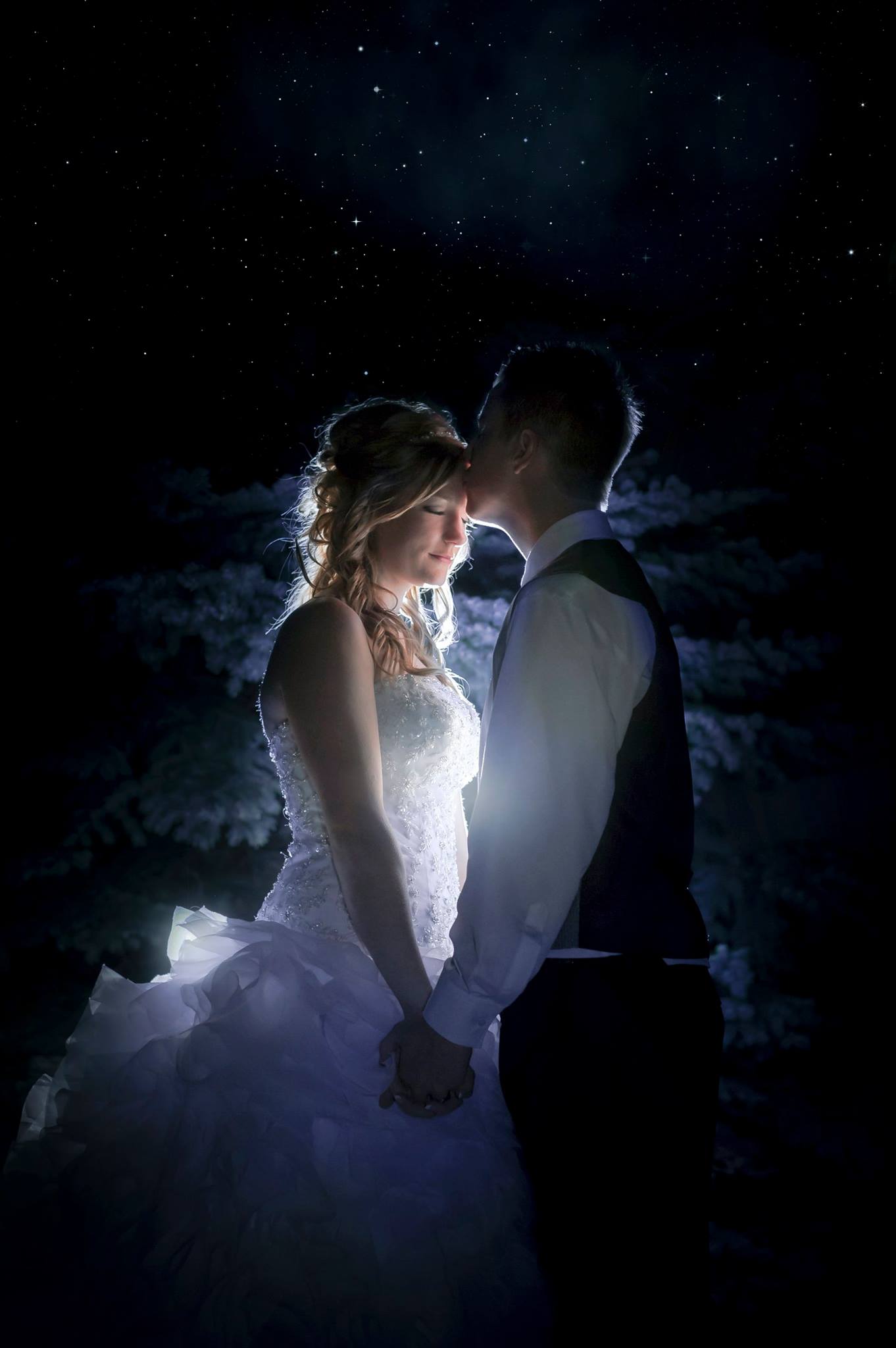 backlit photo of bride and groom at night under the stars (after wedding ceremony had ended) Amherstburg