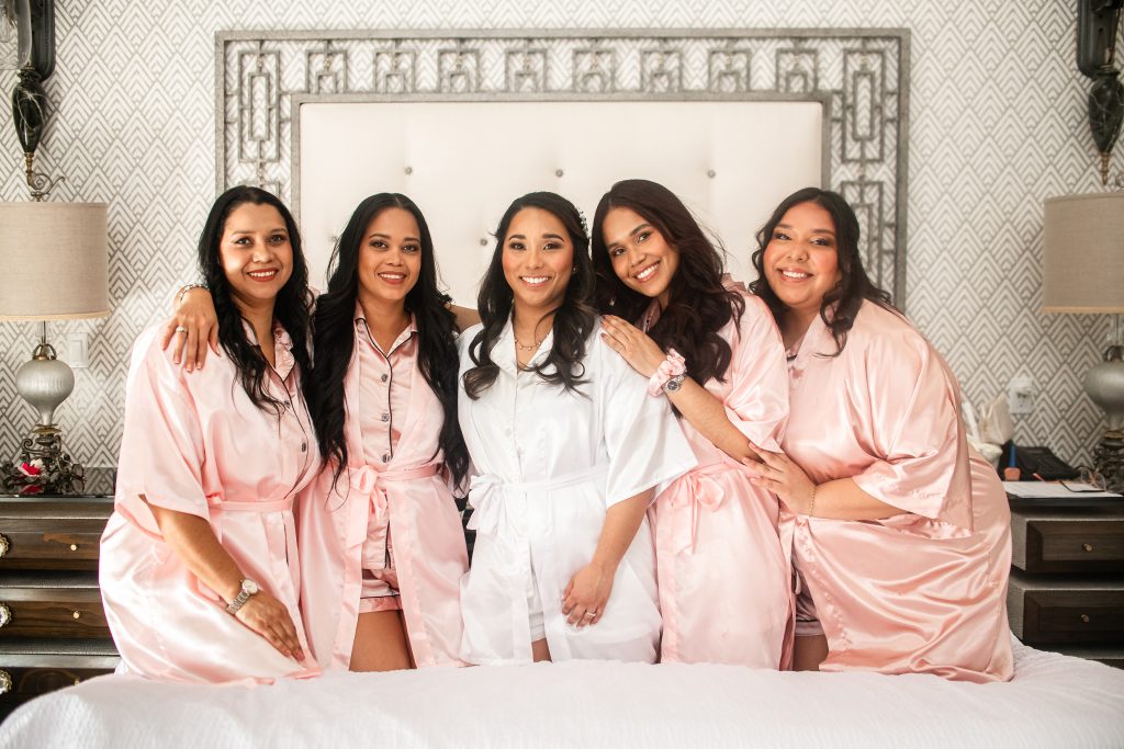 Bride and her girls together before wedding dress was put on