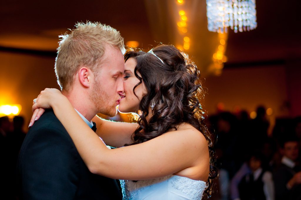 Bride and groom kissing intimately in Chatham Ontario