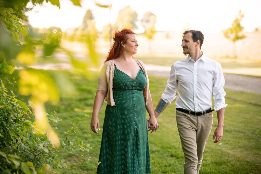 Newly engaged, walking on their engagement shoot