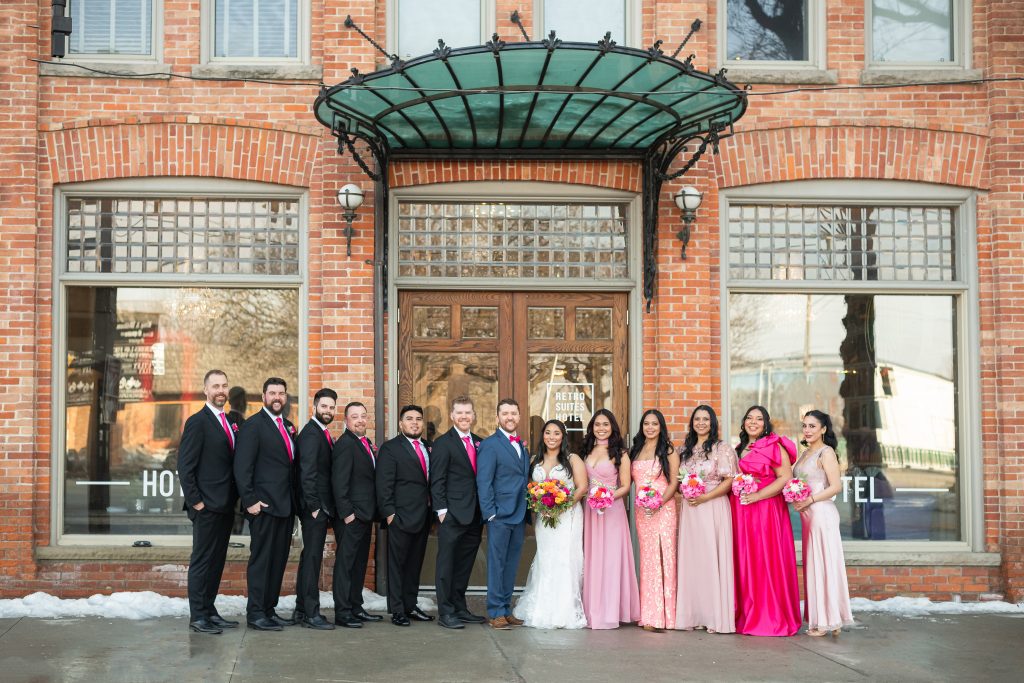 wedding party photographed outside the Retrosuites hotel in Chatham, Ontario