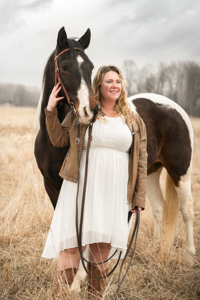 Jordan with horse in a field in Dresden Ontario (pre wedding day photography)