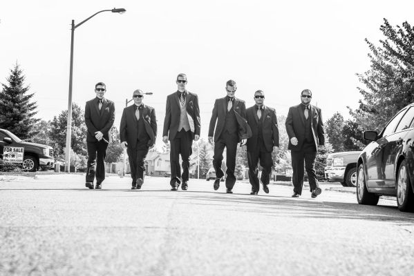 groomsmen walking toward camera in Chatham