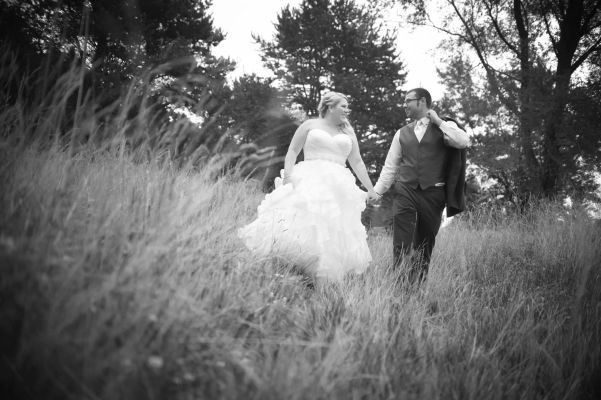bride and groom walking hand in hand