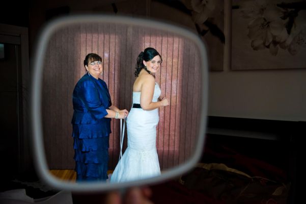 Bride getting ready captured in mirror