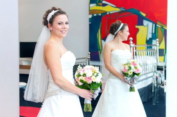 bride standing in front of mirror