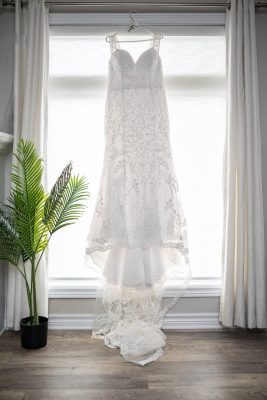 wedding photography of brides dress hanging up