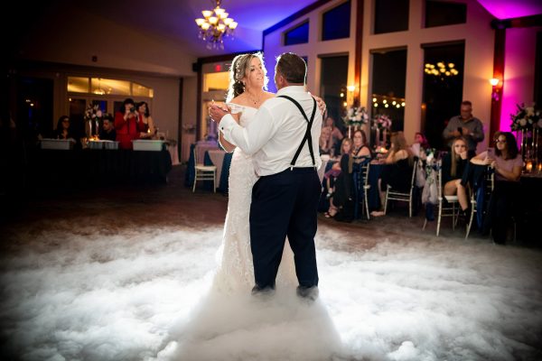 Bride and groom dancing with dry ice on the dancefloor at the links of kent in Chathm
