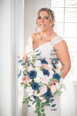bride posing by a window at her home in chatham, ontario