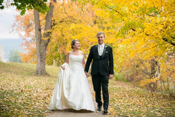 Bride and groom walking in Tecumseh Park Chatham, Ontario