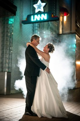 Backlit with smoke/fog behind the retrosuites (bride and groom backlit photo)