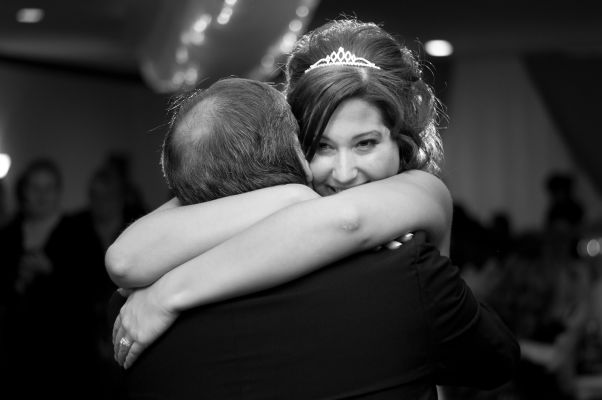Bride hugging her father