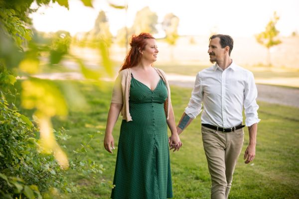 Newly engaged, walking on their engagement shoot