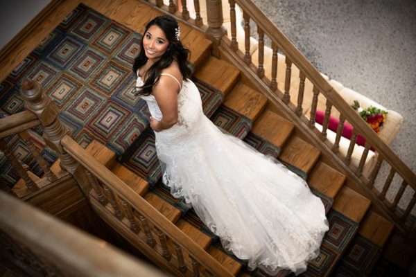 bride walking up the stairs with the focus on her wedding dress (hotel in chatham)