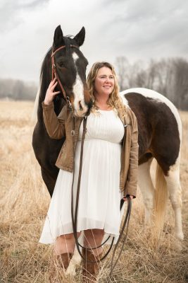 Jordan with horse in a field in Dresden Ontario (pre wedding day photography)