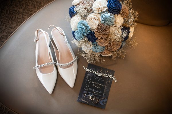 Posed details on wedding day (shoes, bouquet, jewllery & program)